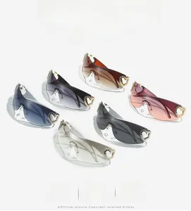 Detail of Y2K wraparound sunglasses featuring hollow heart-shaped rhinestone temples
