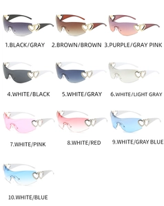 Detail of Y2K wrap sunglasses featuring double heart metal accents and gradient lenses