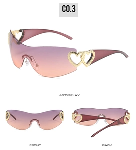 Detail of Y2K rimless wraparound sunglasses with purple gradient lens and gold heart studs