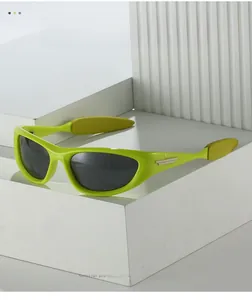 Close-up of futuristic neon green wrap-around sports sunglasses with metal hinge details