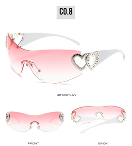 Detail of pink gradient rimless sunglasses with silver hollow heart metal hardware