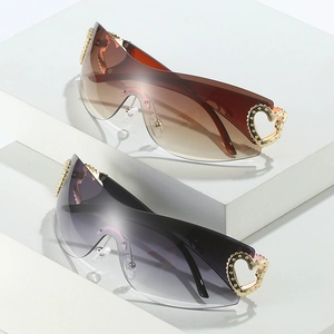 Y2K oversized rimless sunglasses with gradient lenses and golden heart hinge detail