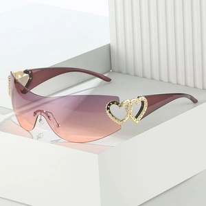Y2K rimless one-piece sunglasses with pink gradient lenses and golden heart detail