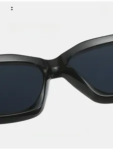 Detail of comfortable integrated nose pads on glossy black square sunglasses frames