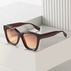 Chic burgundy square sunglasses with warm gradient lenses on a minimalist background