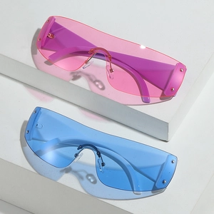Y2K oversized wraparound sunglasses with gradient lenses and rivet details on stone stand