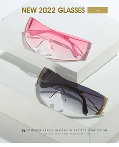 Detail view of Y2K rimless shield sunglasses featuring metal studs and star accents