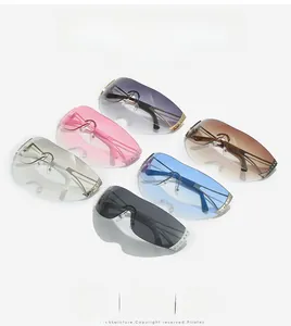 Detail view of colorful rimless Y2K sunglasses with rhinestone accents and metal temples