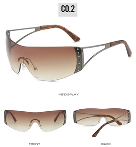 Detail view of Y2K rimless sunglasses with gradient lenses, rhinestones and tortoise arms
