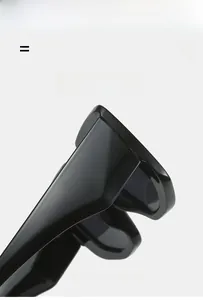 Detail of the high-gloss black sunglasses frame showing light and flexible hinge joint
