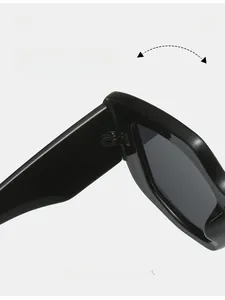 Close-up of durable hinge structure on black square frame sunglasses with sleek finish
