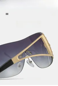 Detailed view of Y2K rimless sunglasses with gold frames and sparkling rhinestones