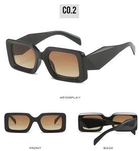 Detail view of retro black square sunglasses with brown gradient lenses and geometric arms