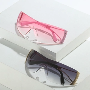 Y2K rimless shield sunglasses with rhinestone star accents on white geometric blocks