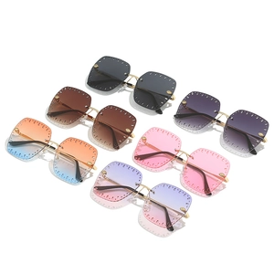 Fashionable rimless square sunglasses with hollow cut-out lenses in various gradient colors