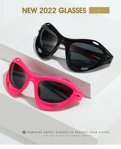 Detail of Y2K sports sunglasses with side vents on pink and black frames