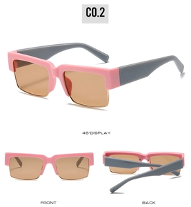 Detail view of square frame sunglasses with pink accent and gold metal rim finish