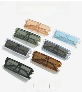 Flat lay of oversized rectangular sunglasses in seven vibrant colors with thick temples