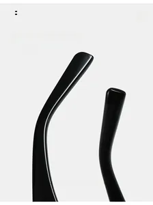 Detail of curved black glossy sunglass temple legs designed for ergonomic ear comfort