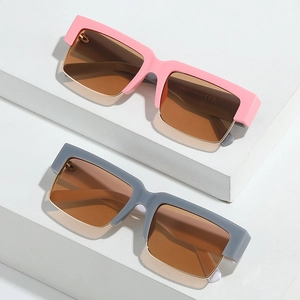 Square semi-rimless sunglasses with metal accents and stylish frames in a lifestyle display