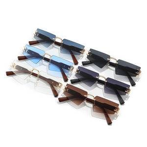 Frameless geometric sunglasses set with colorful lenses and wood grain temple arms