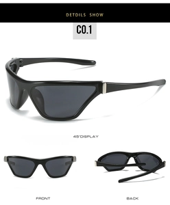 Detail view of black Y2K cat-eye sunglasses with silver metal accents and gray lenses