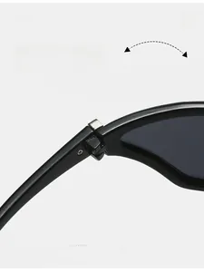 Macro shot of durable metal hinge on Y2K futuristic sporty cat-eye black sunglasses