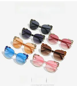 Detailed view of cat-eye sunglasses set with sparkling rhinestones in various lens colors