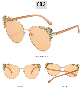 Detailed views of cat eye sunglasses with gold metal frame and rhinestone accents
