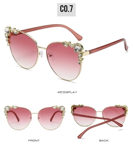 Cat eye sunglasses detail with rhinestone accents and pink gradient lenses in three angles
