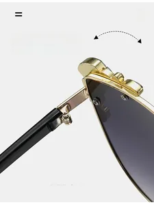 Close-up of durable golden metal hinge on cat-eye sunglasses with smooth folding mechanism