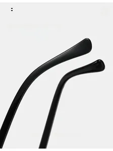 Detail of glossy black curved mirror legs for comfortable oversized cat eye sunglasses