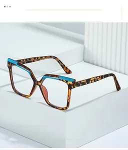 Detail of square tortoiseshell TR90 glasses with distinctive blue top-bar contrast accent