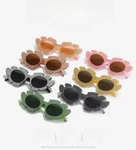 Detailed set of seven flower-shaped glitter sunglasses in vibrant multi-colors for women