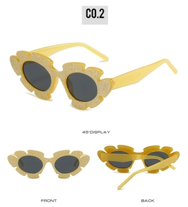 Multi-angle view of children's yellow flower sunglasses with gold glitter and dark lenses