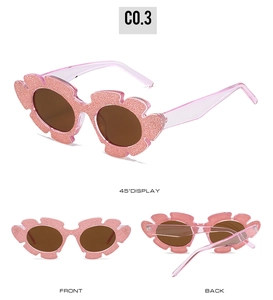 Pink glitter flower shaped sunglasses for girls with brown lenses shown from multiple angles