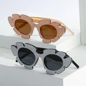 Cat eye glitter sunglasses with wave frames and sparkling rhinestones for party wear