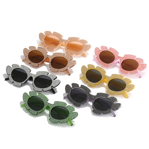 Sparkly cat-eye sunglasses with glitter leaf-shaped frames in seven vibrant colors