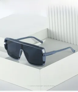 Detail of blue flat top oversized sunglasses with grey seamless one-piece lens