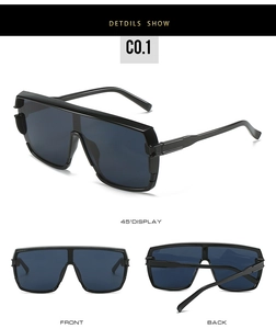 Detail view of oversized shield sunglasses with thick black frames from multiple angles