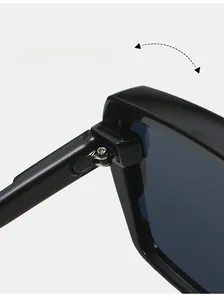 Close-up of durable metal hinge on black oversized sunglasses for high-frequency use