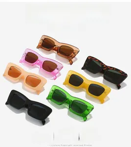 Flat lay display of rectangular cat-eye sunglasses in seven assorted vintage street colors
