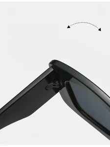 Detail view of durable metal hinge on black cat eye sunglasses with high-gloss finish