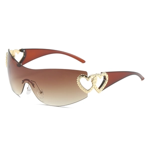 Y2K rimless wrap sunglasses with brown gradient lenses and gold heart side detail