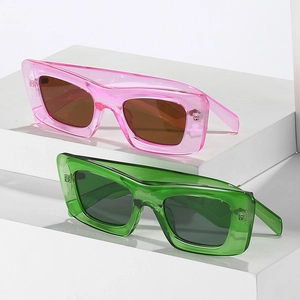 Fashionable cat eye sunglasses with translucent pink and green rectangular frames