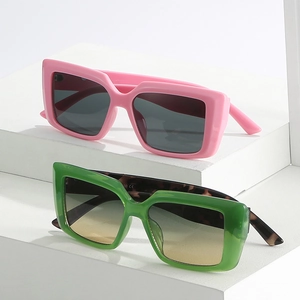 Chic oversized square sunglasses with metal accents in pink and tortoise green frames