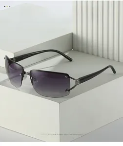 Close-up of rimless gradient sunglasses featuring side rhinestones and black temples