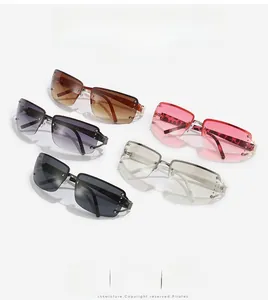 Detail of rimless Y2K sunglasses with sparkling rhinestones and leopard print arms