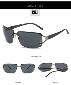 Detail view of large grey rectangle sunglasses with sparkling rhinestone accents