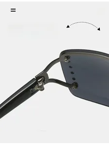 Detailed close-up of the durable metal hinge on vintage oversized black sunglasses